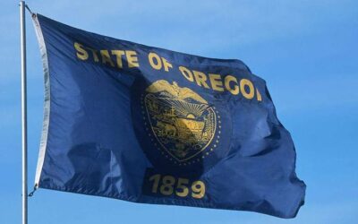 Oregon state flag flying on flag pole