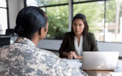 Female Veteran speaking to a lender at a desk