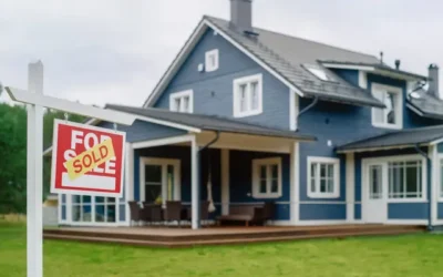 home with a home sold sign in front lawn