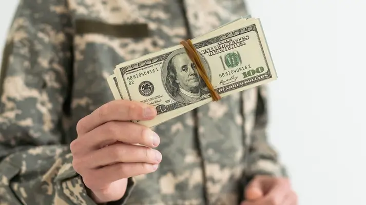 Veteran holding cash