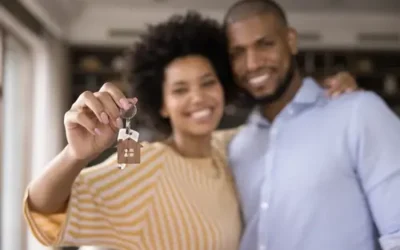 African American couple in new home holding keys
