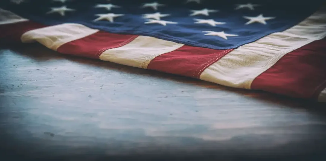 flag resting on Veteran tombstone