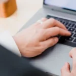 guy on laptop checking va rates