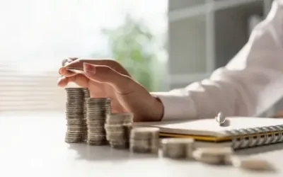 lady counting coins at desk