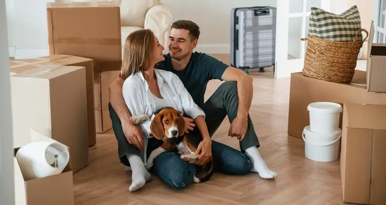 couple moving into a new home with a dog