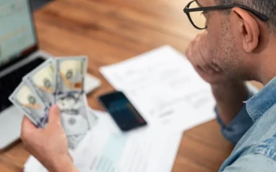 Active duty service member looking at a calculator screen showing how non-taxable BAH income is grossed up to increase VA loan buying power.