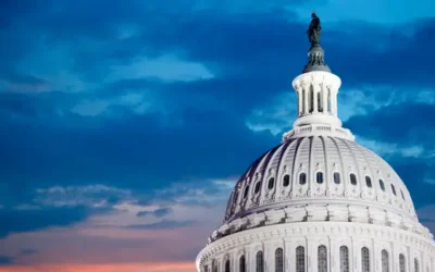 U.S. Capitol dome illuminated at twilight.