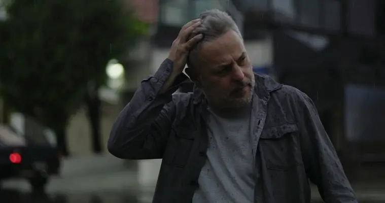 Man in rain frustrated with life about VA Loan study