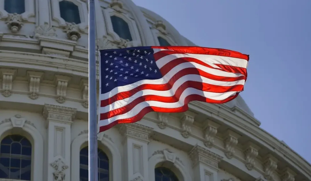 american flag flying in the wind on capital hill - government shutdown ending