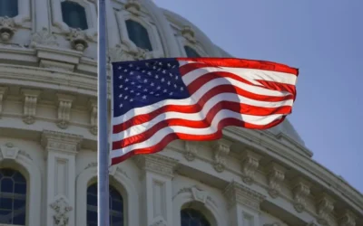american flag flying in the wind on capital hill - government shutdown ending