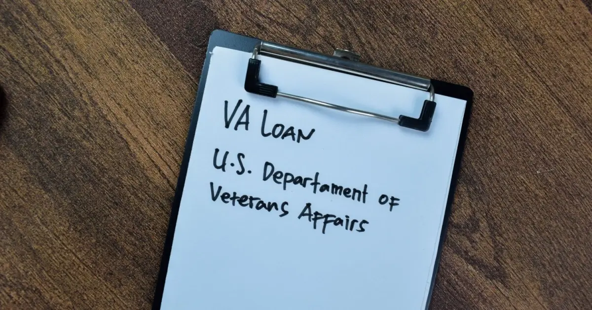 Veteran signs VA home loan papers and receives house keys, symbolizing closings resuming after the government shutdown ends and backlog clears