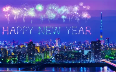 Happy New Year fireworks celebrating over Tokyo cityscape at night