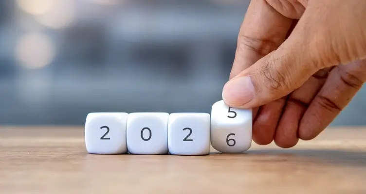 guy turning dice that read 2026