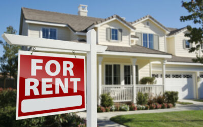House with a for rent sign in front yard