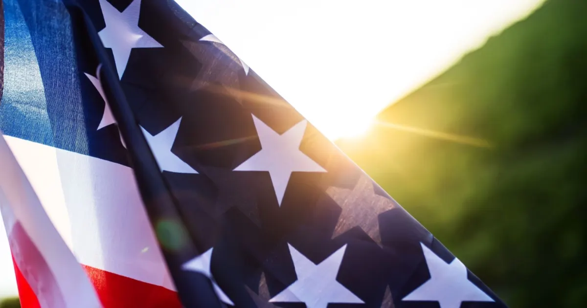 Close up of American flag waving in sunlight