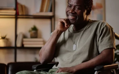 Disabled Veteran sitting at home and smiling during a conversation