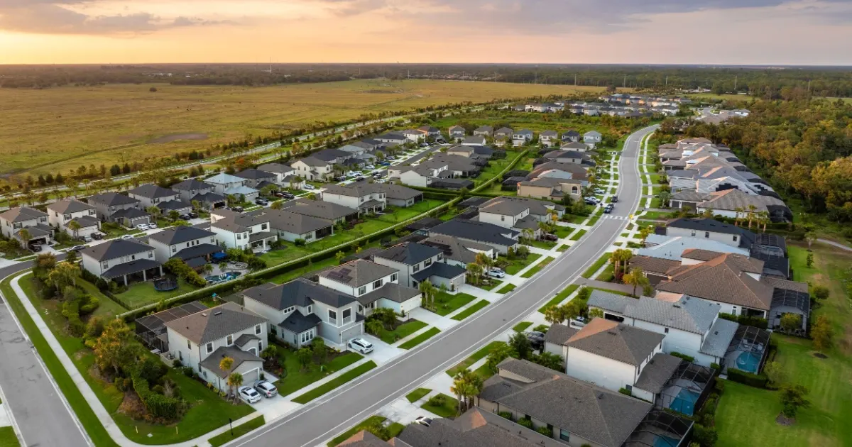 Aerial view of a large suburban neighborhood with single family homes in rural area